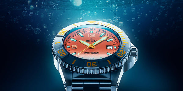 DELMA Blue Shark IV with orange dial underwater